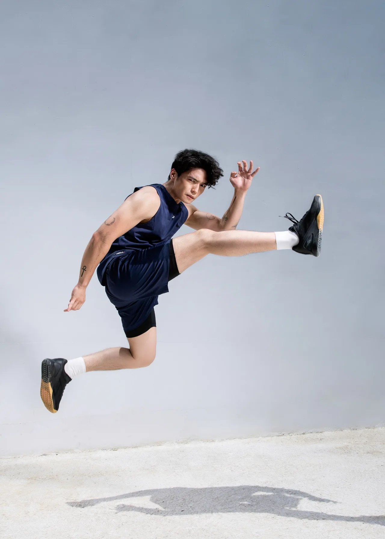 Huy Tran in sleeveless reebok gym set