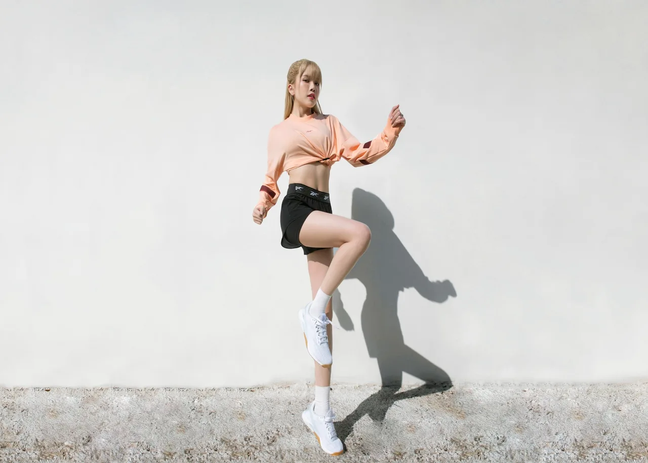 Thieu Bao Tram in pink Reebok croptop Thieu Bao Tram in pink Reebok croptop