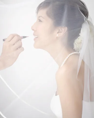 Bride Having Lipstick Applied