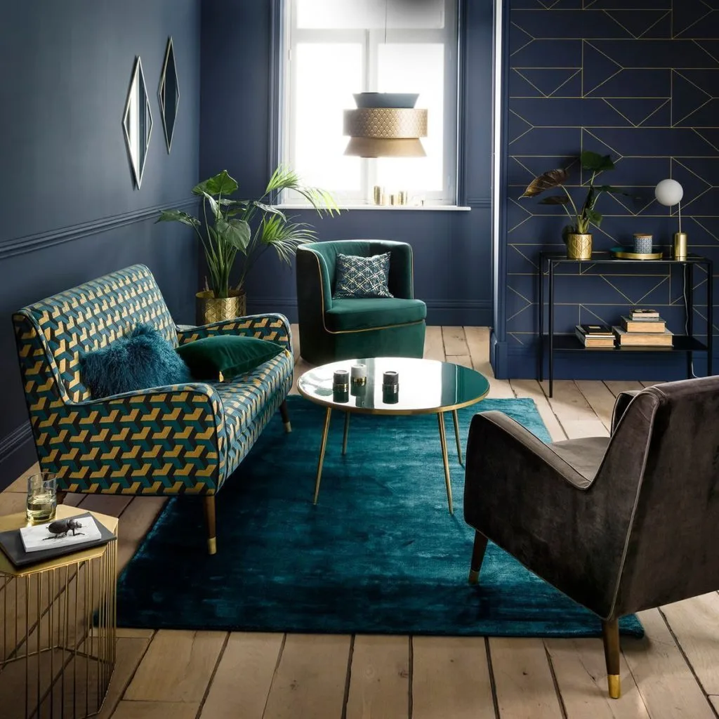 Nhà trang trí phong cách Art Decor gồm các vật liệu sang trọng như kim loại bóng, gương, đá cẩm thạch và những gam màu sâu như xanh ngọc, đen huyền hoặc vàng đồng