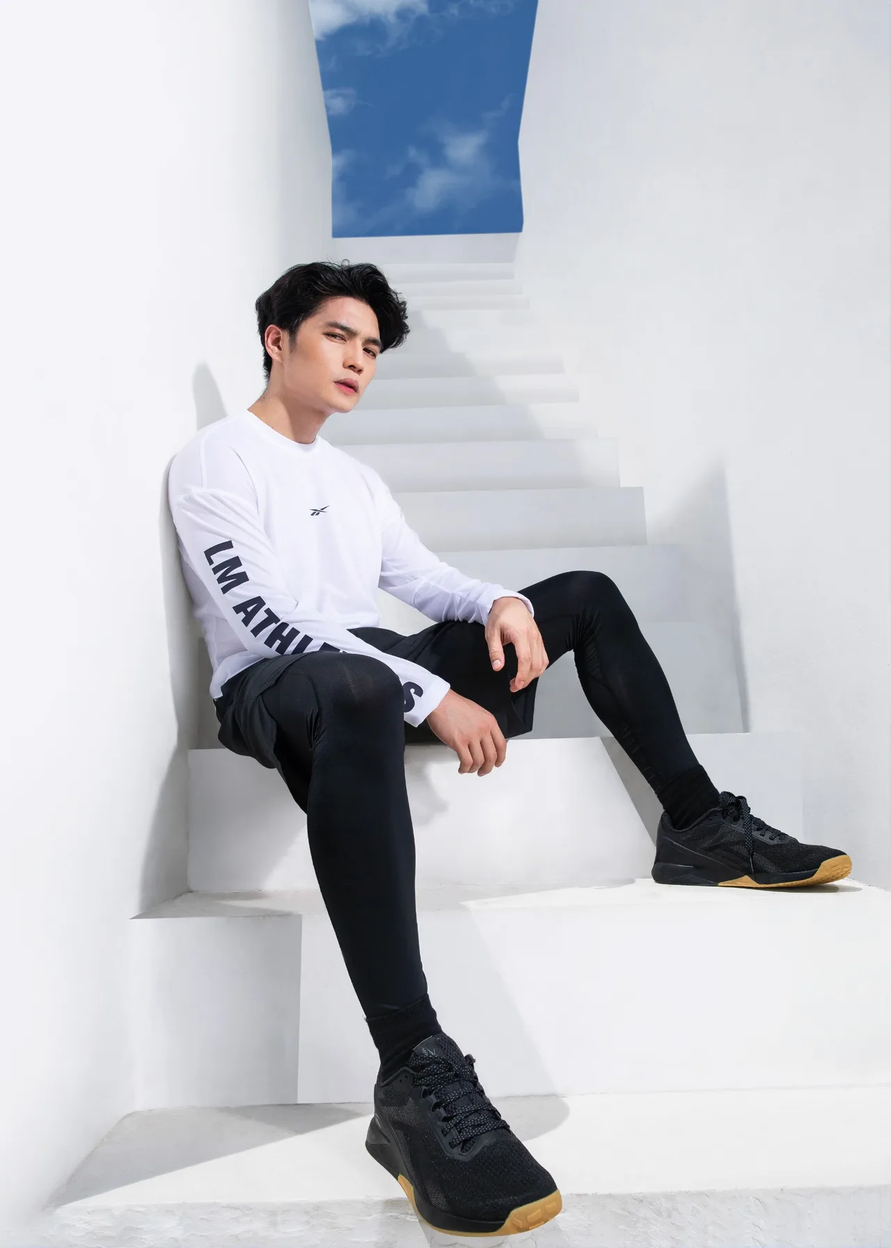 Huy Tran in Reebok Black and White Gym set
