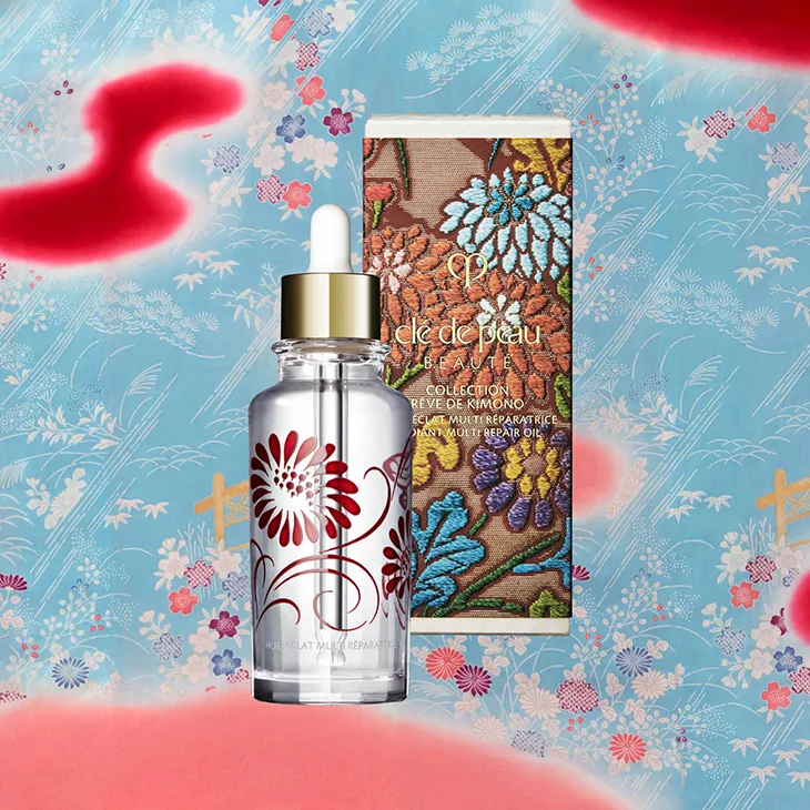 dầu dưỡng cle de peau beaute radiant multi repair oil giấc mơ kimono chai thuỷ tinh trong suốt vỏ thêu nền xanh biển