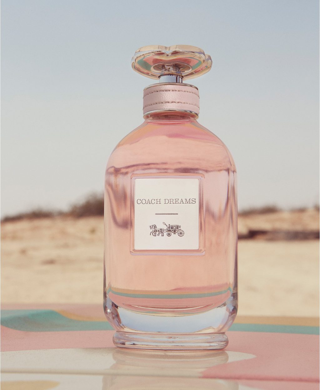 Coach Dreams - chai nước hoa mùa Hè mở ra giấc mơ về những chuyến đi xa.