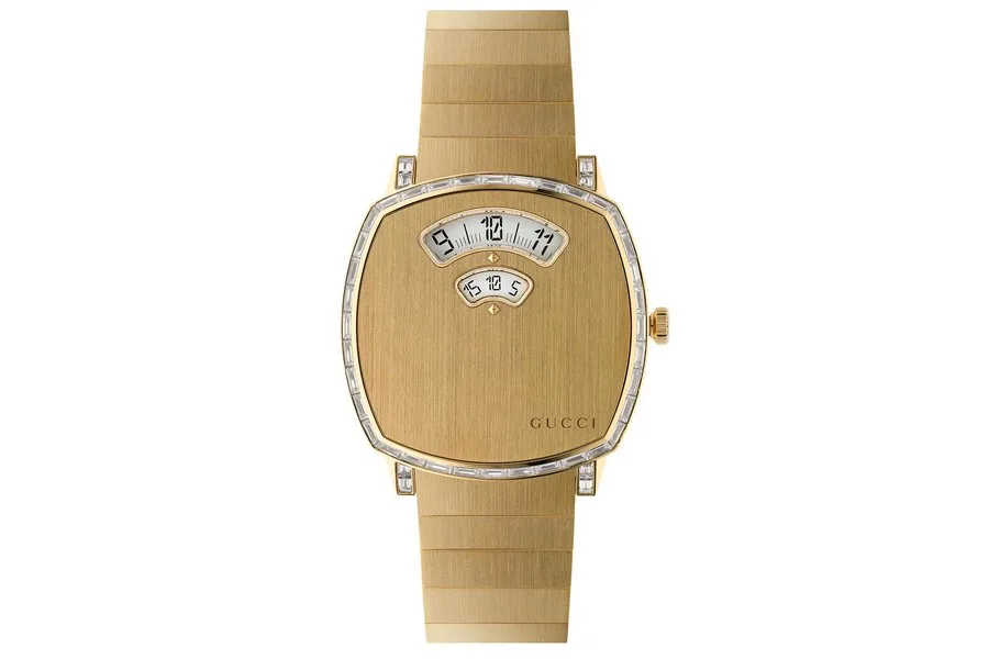 gucci grip in 18k gold with baguette diamonds